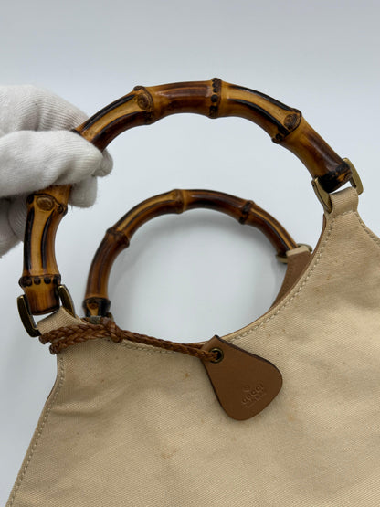 Gucci-Borsa-Vintage-con-Manici-in-Bamboo-e-Dettagli-Intrecciati-Beige-70493925179716 - Pally Vintage Closet